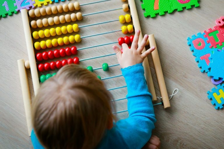 Motivating Your Child to Learn Child playing with toys - Underwood Early Learning Centre