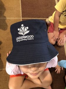 Child wearing an Underwood Early Learning Centre hat