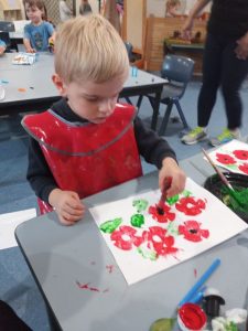Boy making art with paint - Cannon Hill Early Learning Centre