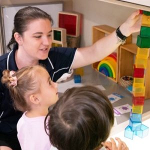 Caretaker showing kids some blocks - Underwood Early Learning Centre
