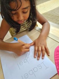 Little gril writing - Daisy Hill Early Learning Centre