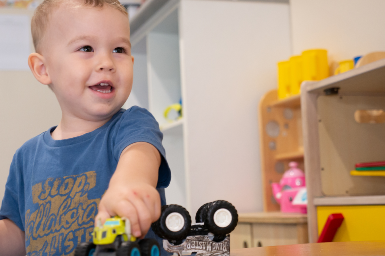 Learning_Through_Play Kid Playing Toy Truck - Your ELC