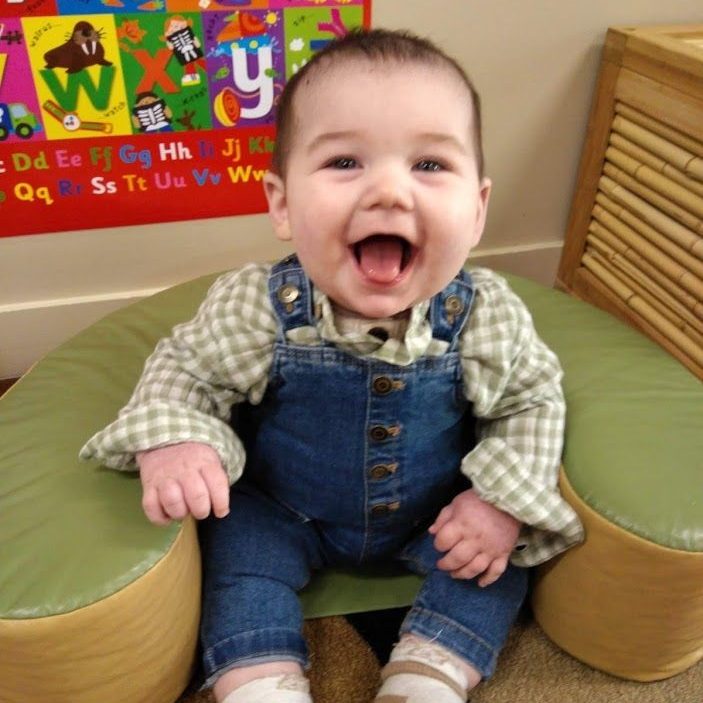 Baby smiling - Cleveland Early Learning Centre