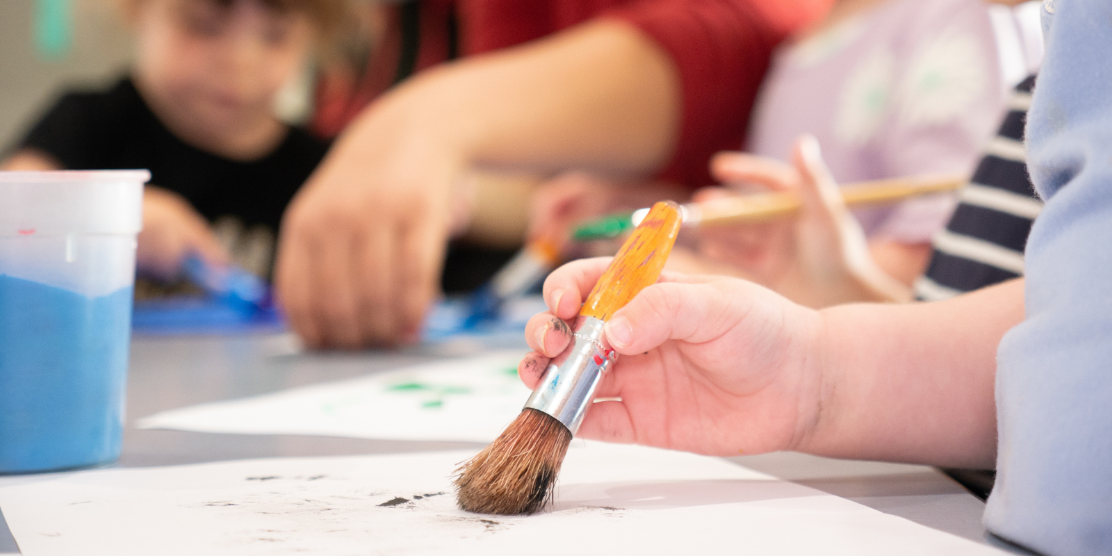 Gross motor Kid Holding a Paint Brush - Difference Between Fine and Gross Motor Skills - Early Learning Centre