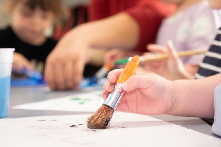 Gross motor Kid Holding a Paint Brush - Difference Between Fine and Gross Motor Skills - Early Learning Centre