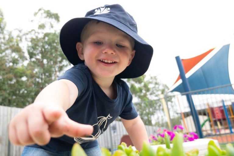Kids-Asking-Questions-1024×576 A Kid Reaching to Touch a Plant Outside - Importance of Encouraging Child to Ask Questions - Early Learning Centre