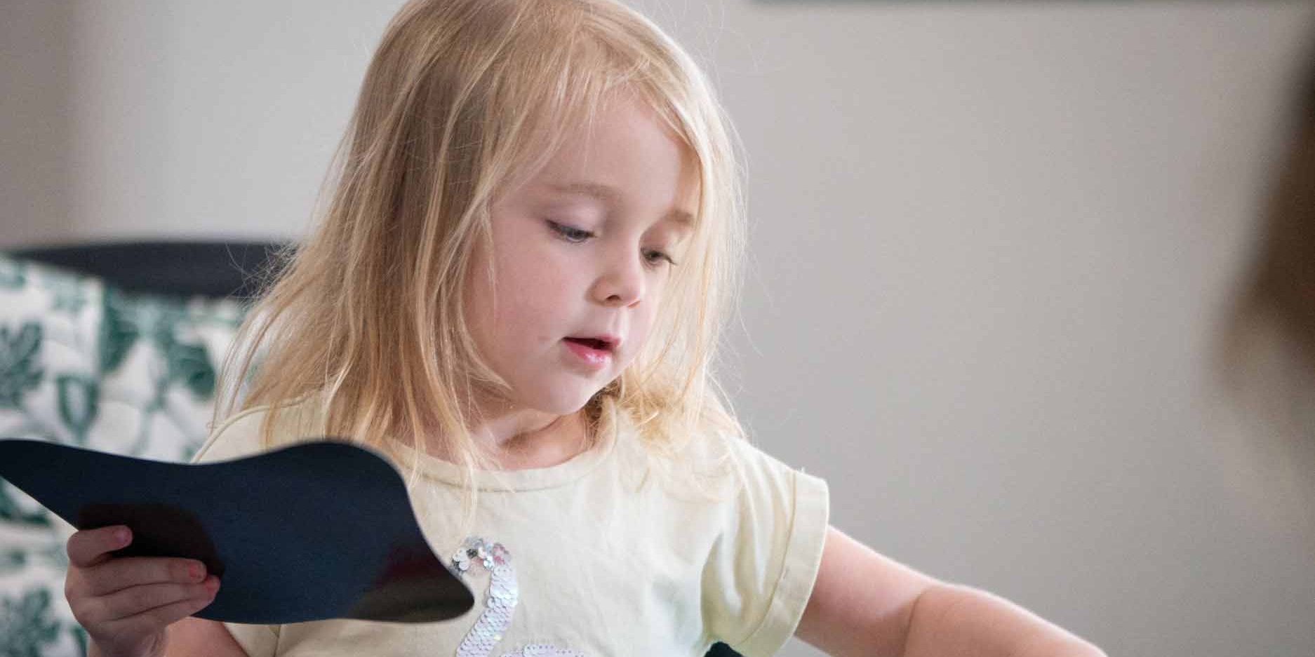 solo-play-blog Little girl at the table doing some activity - Benefits of Solo Play - Your ELC