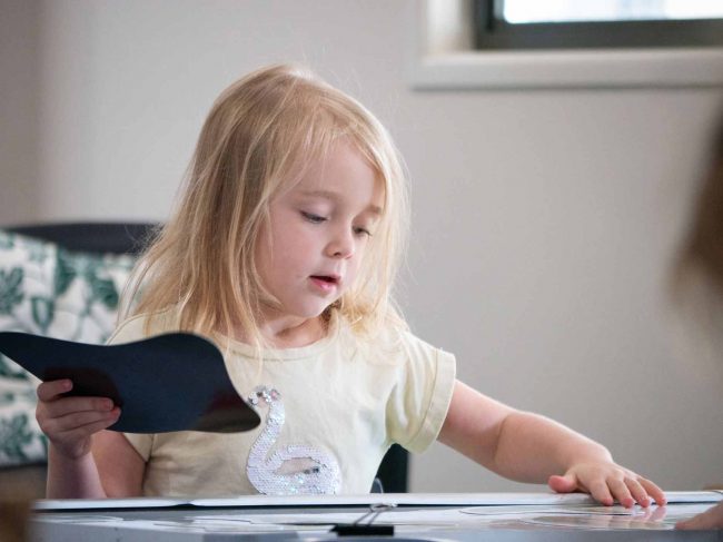 solo-play-blog Little girl at the table doing some activity - Benefits of Solo Play - Your ELC