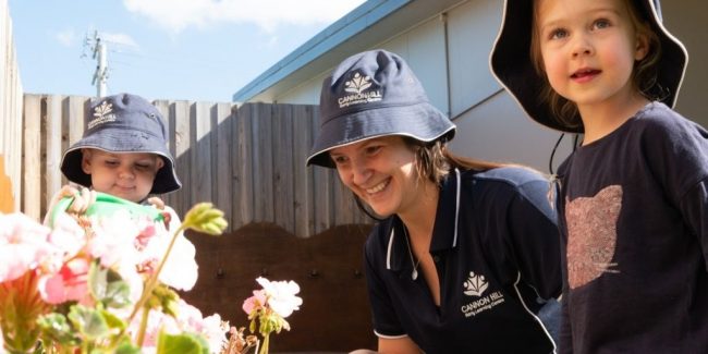 jan-blog-5 ways children benefit from going to childcare Kids and their teacher outside looking at flowers - Your ELC Blog Image