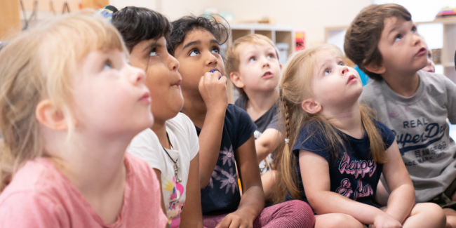 Happy children Children listening at the centre - Your ELC
