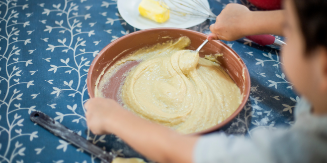 Cooking is a great way to get your children involved with what they eat, and it gives you the opportunity to teach them some healthy eating habits A kid mixing ingredients in a bowl - Your ELC