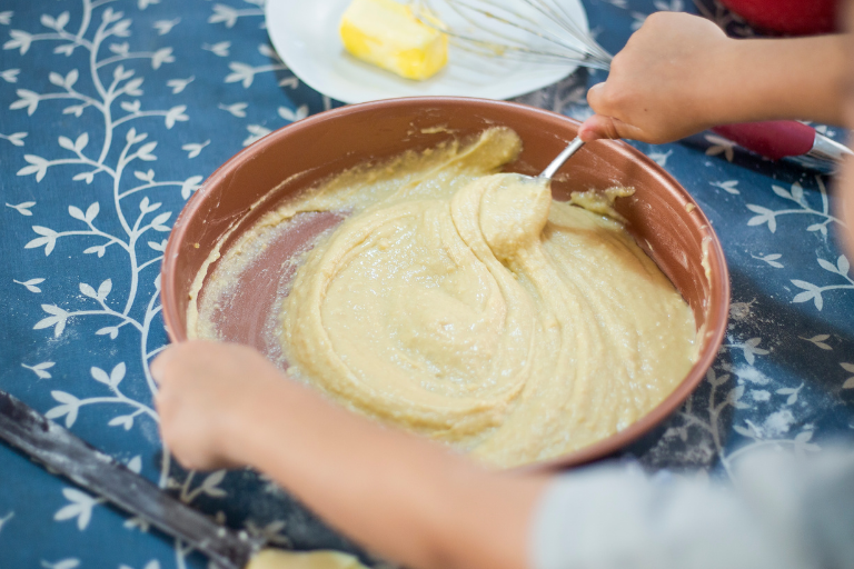 Cooking is a great way to get your children involved with what they eat, and it gives you the opportunity to teach them some healthy eating habits A kid mixing ingredients in a bowl - Your ELC