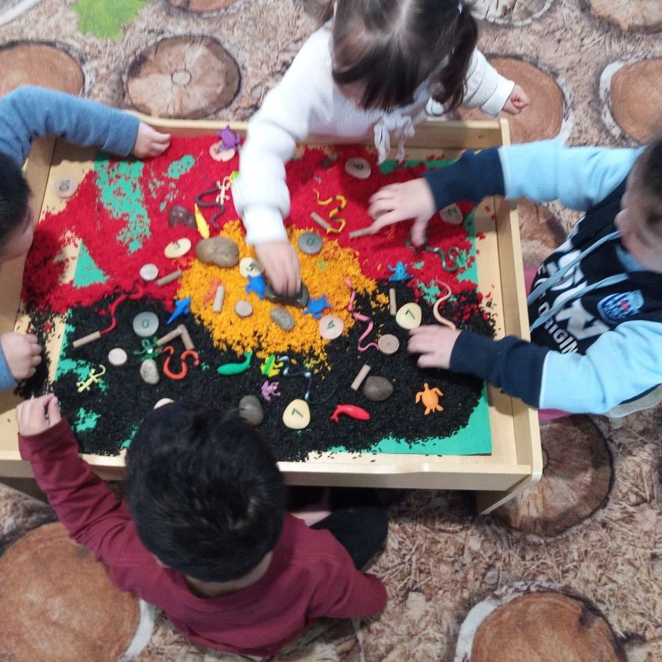 Kids playing with different water animal toys - Doolandella July 2022 Newsletter