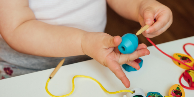 Fine Motor Skills Tips A child doing some fine motor skills activities - Your ELC