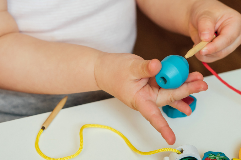 Fine Motor Skills Tips A child doing some fine motor skills activities - Your ELC