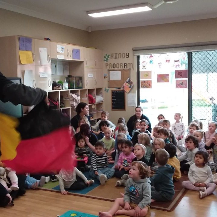 Children watching a magician perform in the classroom - Your ELC