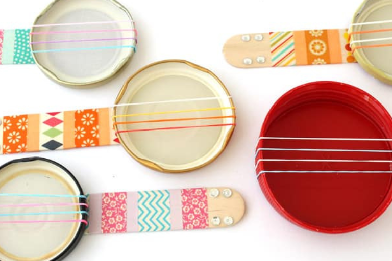 Syzan Newsletters Banjo Several mini lid banjos - DIY activity of the month - Your ELC blog image