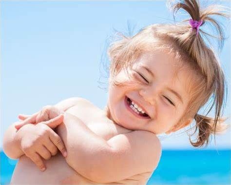 Little girl laughing in an outdoor setting - Your ELC newsletter image