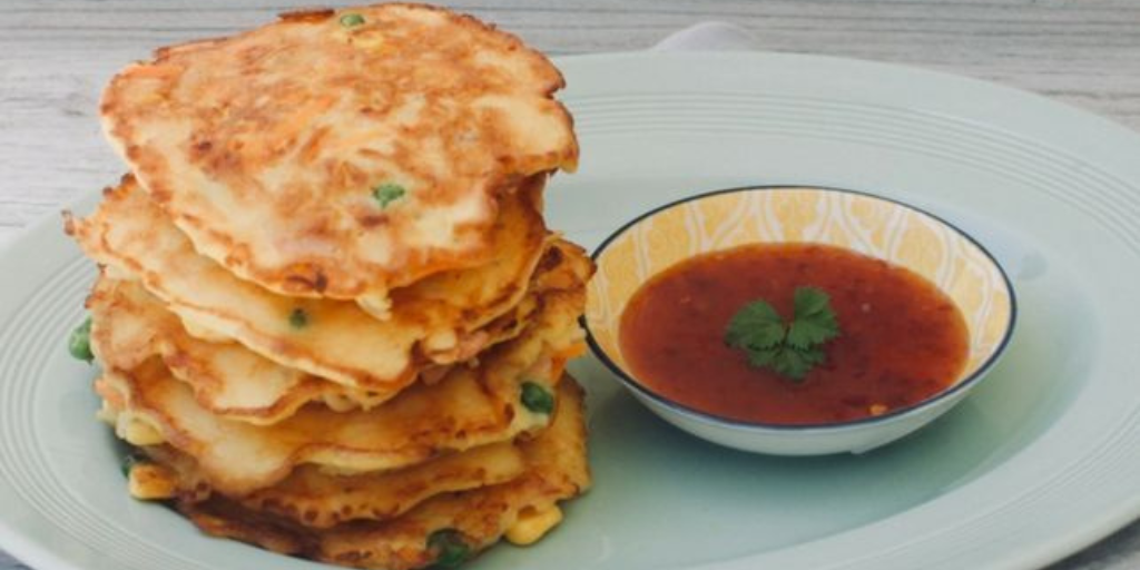 Noodle Fritters Homemade noodle fritters stacked with a sauce on the side - Your ELC blog image