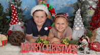Two kids smiling with Christmas hats and background - Your ELC