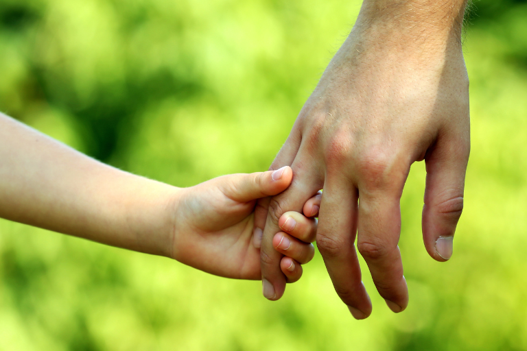 Room Transitions Child holding and adult's hand | Your ELC blog image