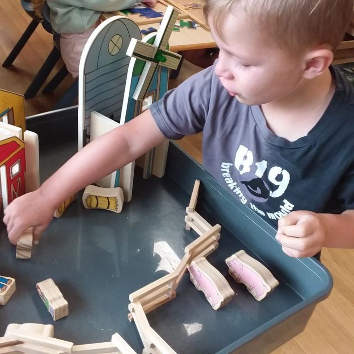 Child playing wooden blocks | Your ELC blog image