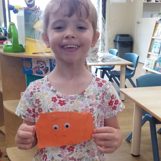 A child holding an artwork | Your ELC blog image