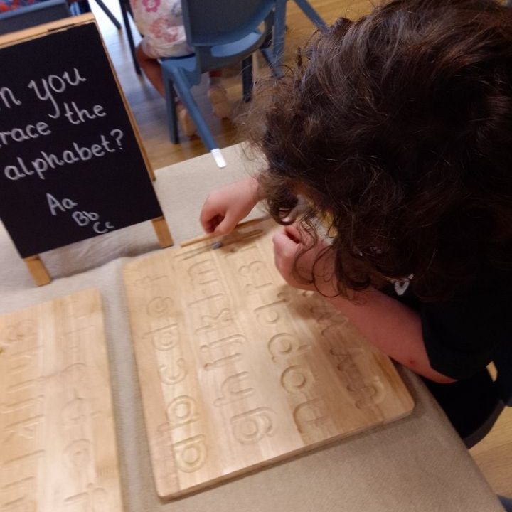 A child playing alphabet blocks | Your ELC blog image