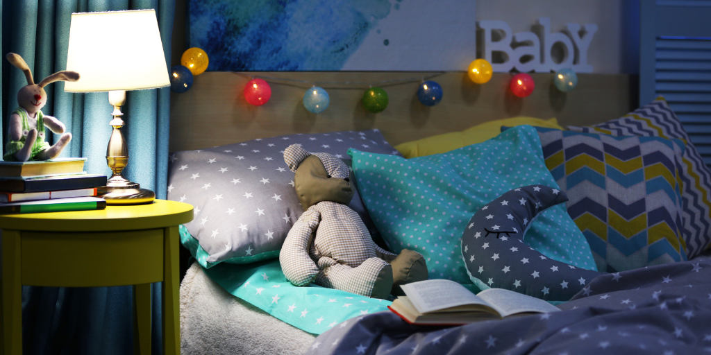 Soothing Bedtime Routine Child's bedroom with books and lamp on bedside table | Your ELC blog image