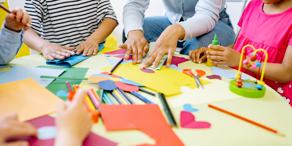 Kindergarten Play Kindergaten children playing around a table | Your ELC